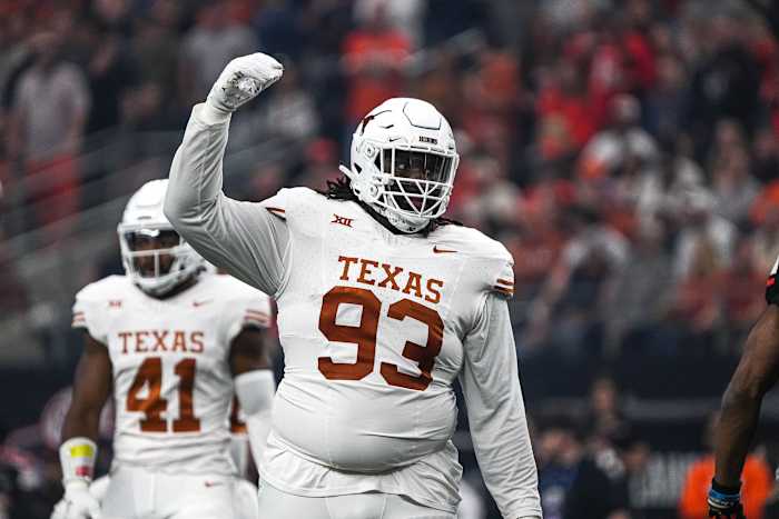 Texas Longhorns defensive lineman T'Vondre Sweat (93) celebrates a defensive stop during the Big 12 Championship game against the Oklahoma State Cowboys at AT&T stadium on Saturday, Dec. 2, 2023 in Arlington.